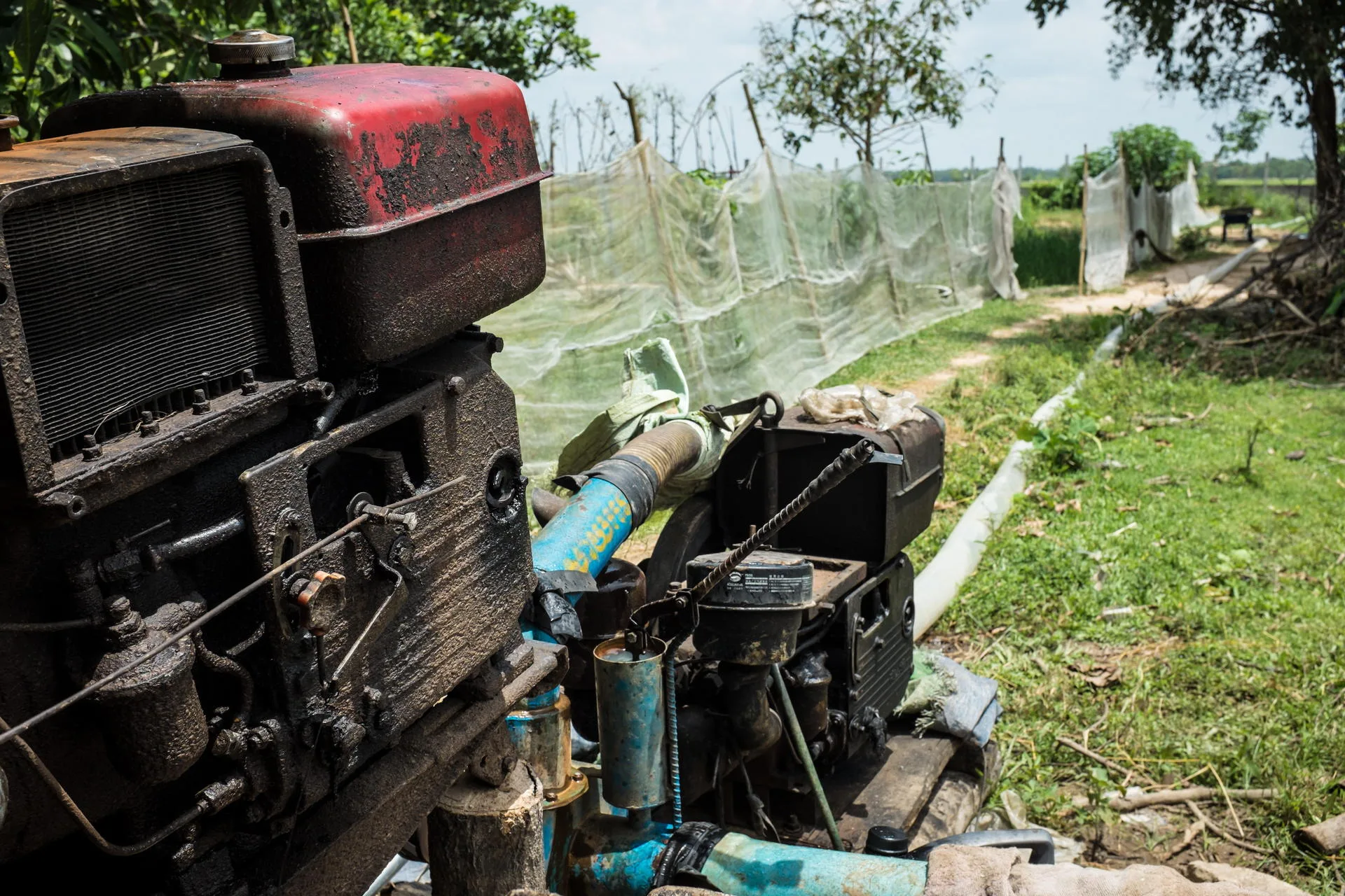 A diesel-powered pump pushes water out to the rice fields.