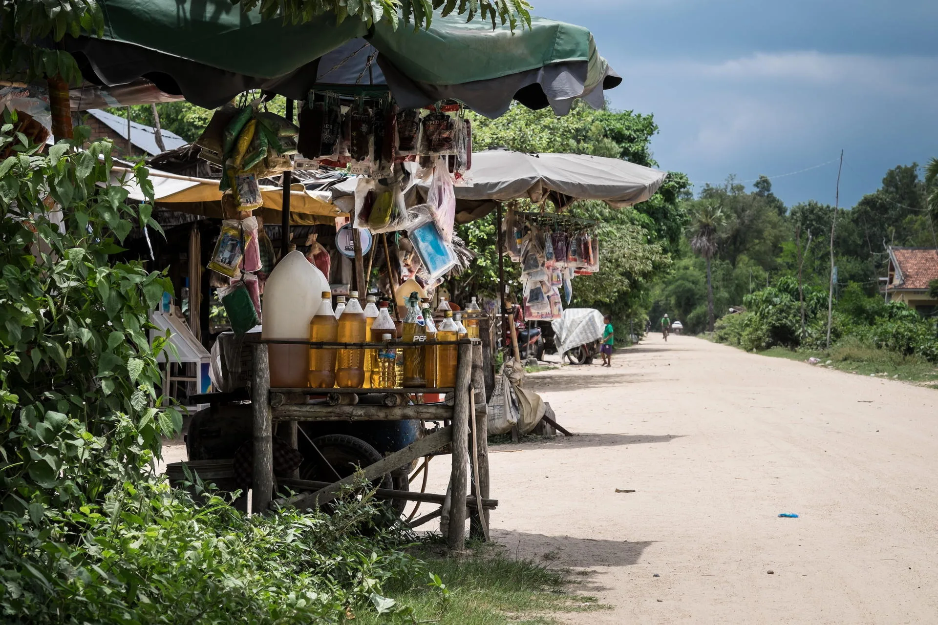 Local residents sell petrol, face masks (against the dust) and snacks and drinks out the front of their houses.